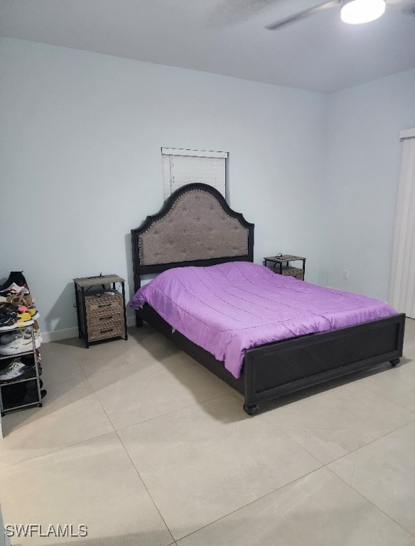 bedroom featuring light tile patterned flooring and ceiling fan