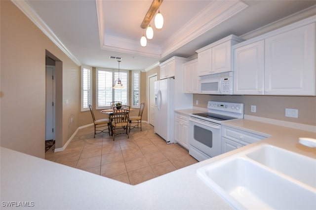 kitchen with white cabinets, crown molding, a tray ceiling, pendant lighting, and white appliances