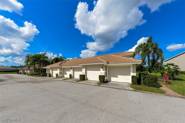 view of front of property with a garage