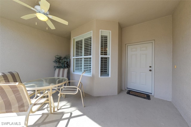 exterior space with ceiling fan