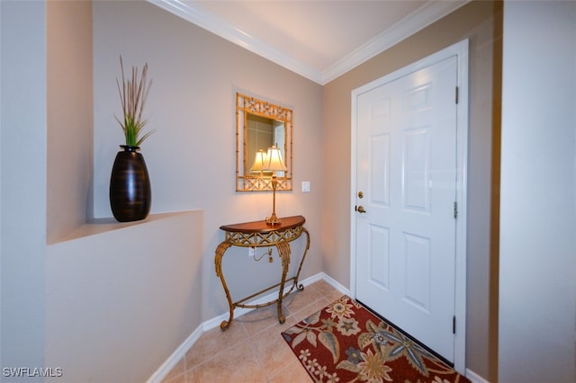 entryway with light tile patterned flooring and ornamental molding