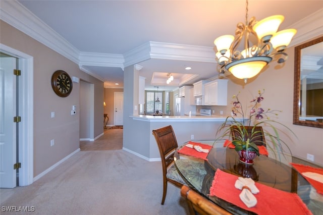 dining room featuring light carpet, an inviting chandelier, and ornamental molding