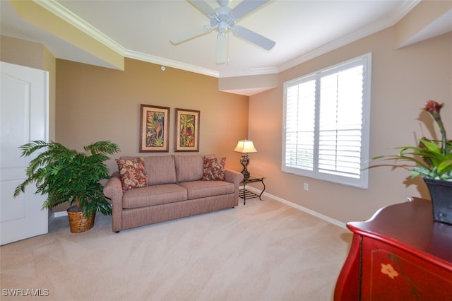 living room with ceiling fan, light colored carpet, and ornamental molding