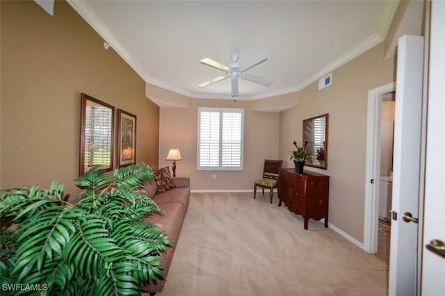 interior space with ceiling fan, light colored carpet, and crown molding