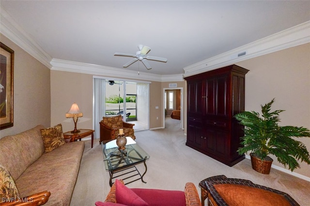 carpeted living room with ceiling fan and ornamental molding