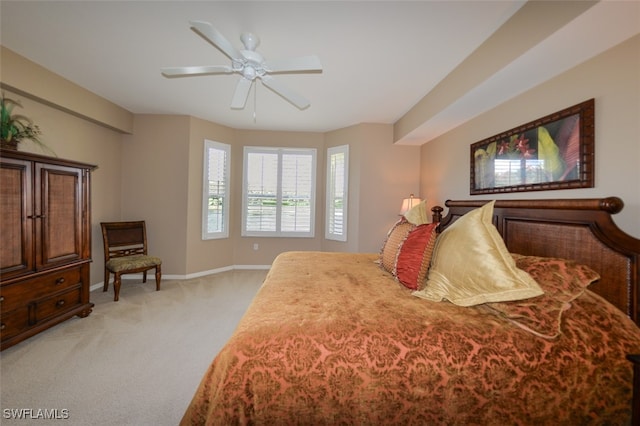 bedroom with ceiling fan and light colored carpet