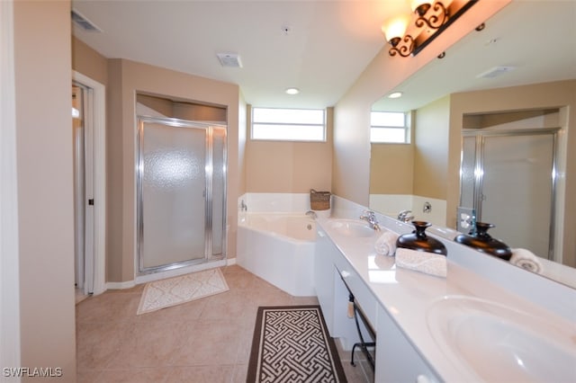 bathroom with vanity, tile patterned floors, and plus walk in shower