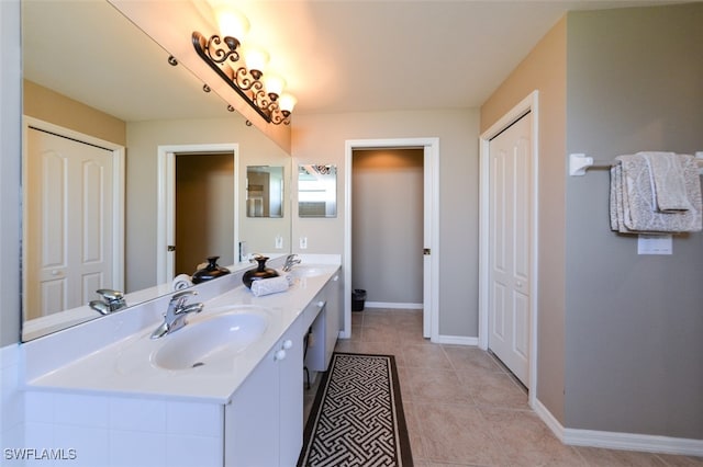 bathroom featuring tile patterned flooring and vanity