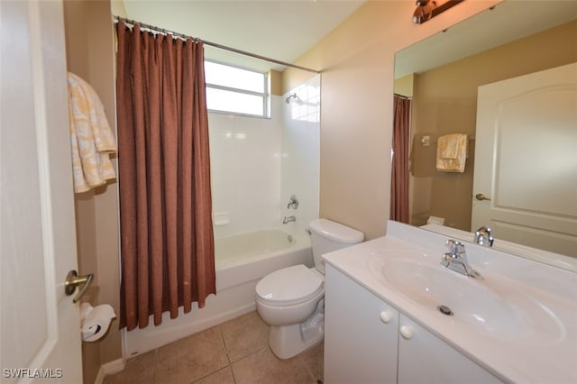 full bathroom featuring toilet, vanity, tile patterned floors, and shower / tub combo with curtain