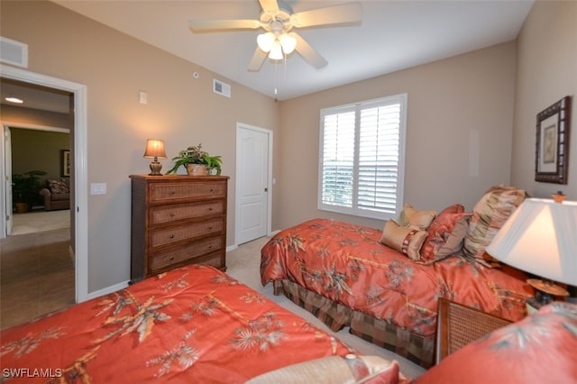 tiled bedroom with ceiling fan