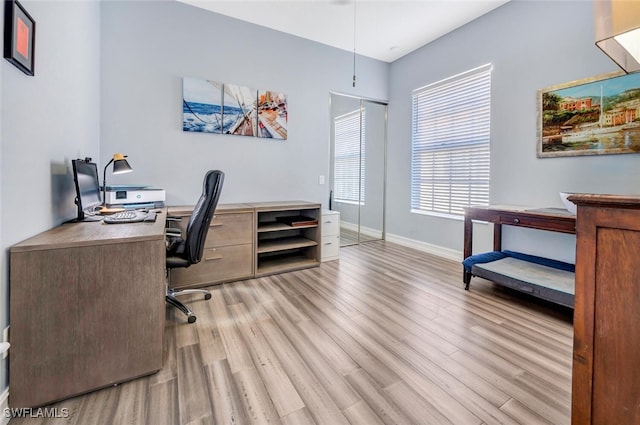 office with light wood-type flooring