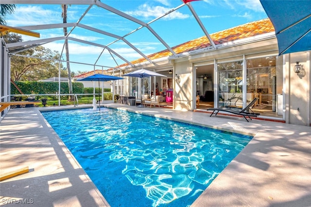 view of pool featuring a lanai and a patio area