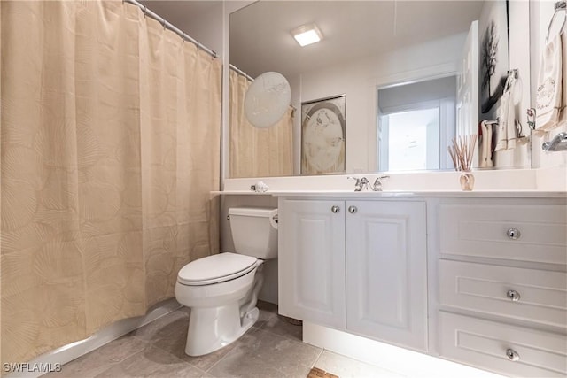 full bathroom featuring toilet, tile patterned flooring, and vanity