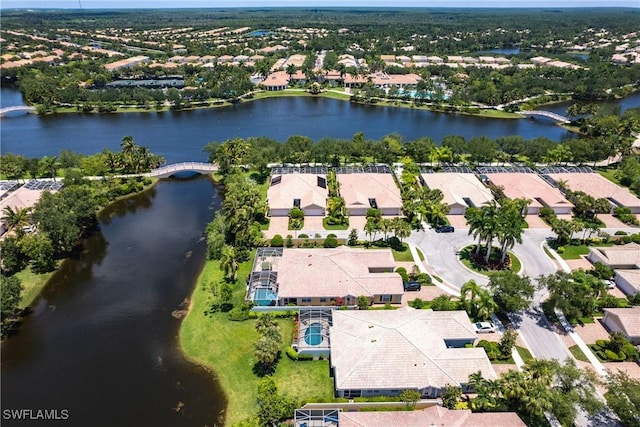 bird's eye view with a residential view and a water view