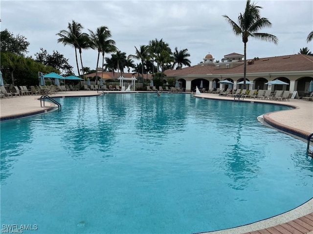 community pool with a patio area