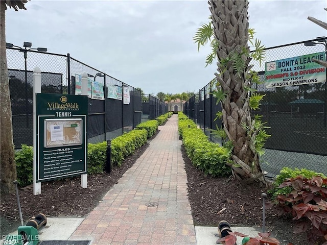 view of home's community with fence