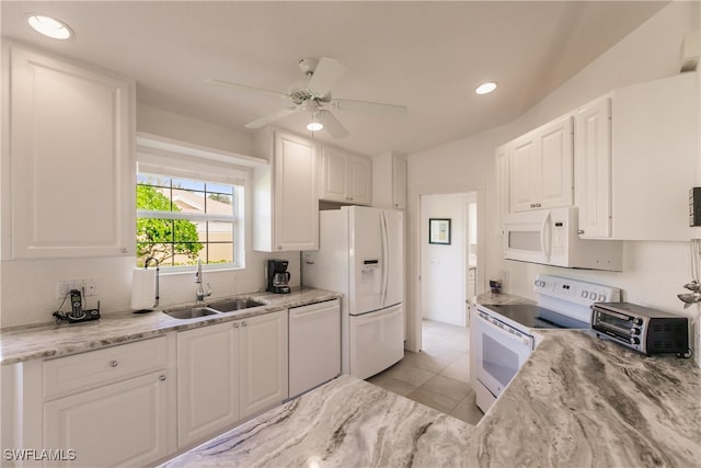 kitchen featuring sink, light tile patterned floors, white cabinets, white appliances, and ceiling fan