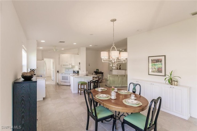 dining space featuring ceiling fan with notable chandelier, visible vents, and recessed lighting