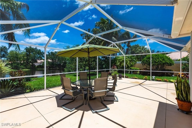 view of patio / terrace featuring a lanai