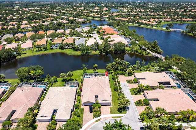 bird's eye view with a water view and a residential view