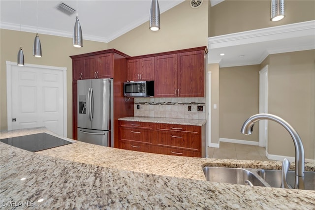 kitchen featuring pendant lighting, stainless steel appliances, crown molding, and sink