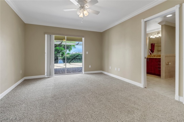 carpeted empty room featuring ceiling fan and ornamental molding