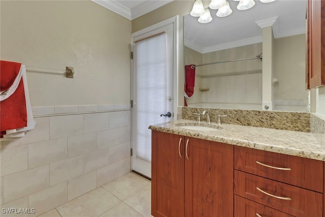 bathroom featuring vanity, crown molding, and tile patterned flooring