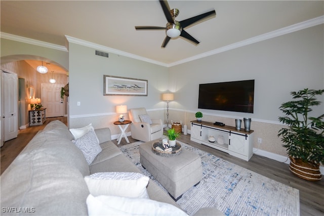 living room featuring crown molding, hardwood / wood-style flooring, and ceiling fan