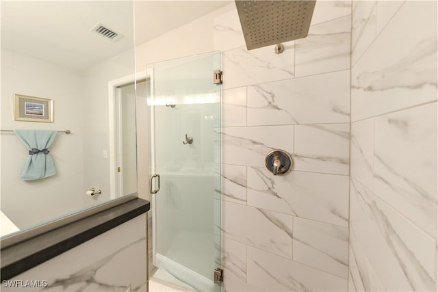 bathroom featuring an enclosed shower