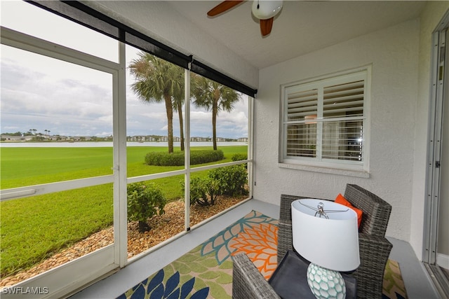 sunroom with plenty of natural light and ceiling fan