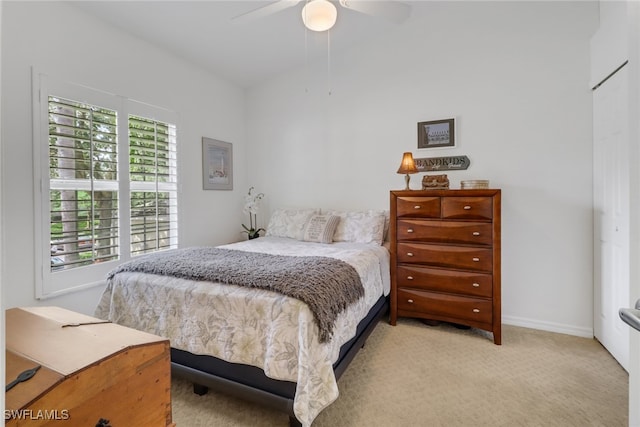 carpeted bedroom with ceiling fan