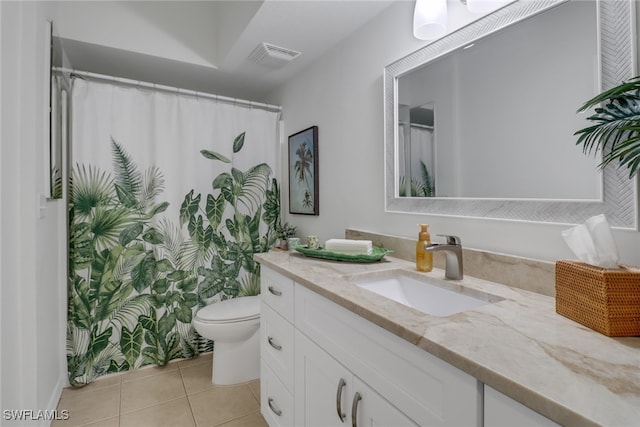 bathroom with tile patterned flooring, a shower with shower curtain, vanity, and toilet