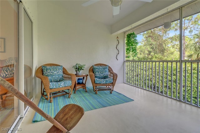 sunroom featuring ceiling fan