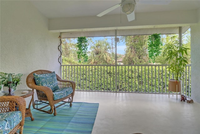 sunroom / solarium featuring ceiling fan and a wealth of natural light