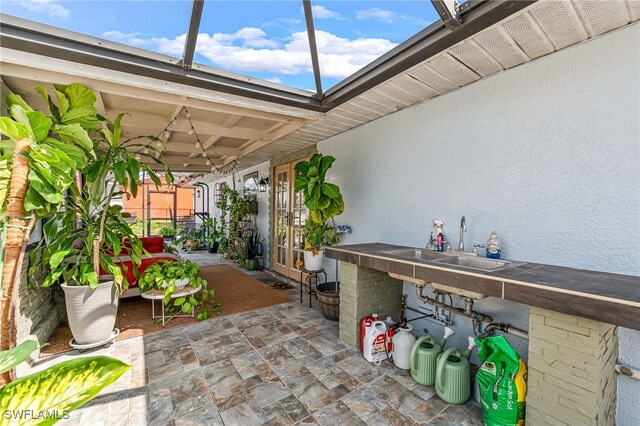 view of patio featuring an outdoor wet bar