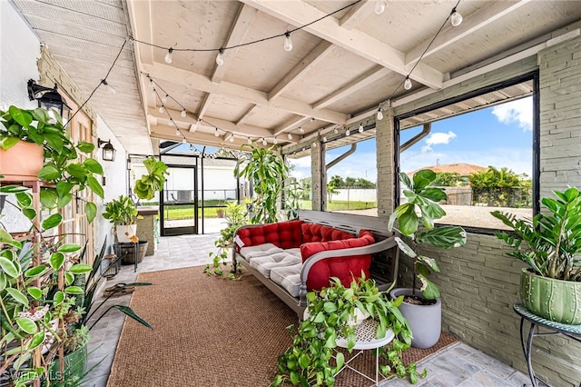 sunroom featuring a mountain view