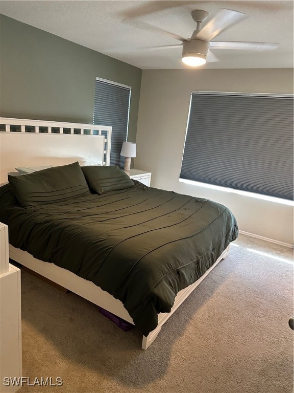 bedroom with carpet flooring and ceiling fan