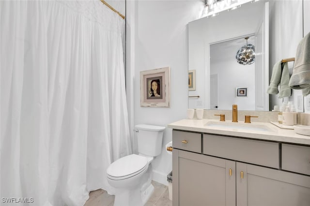 bathroom featuring vanity, a shower with curtain, toilet, and tile patterned flooring