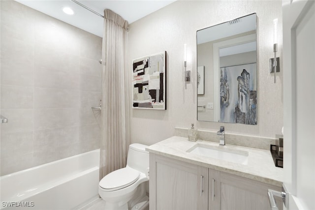 full bathroom featuring vanity, toilet, and shower / bathtub combination with curtain