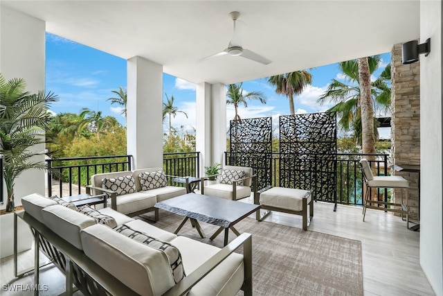 view of patio with ceiling fan and an outdoor hangout area