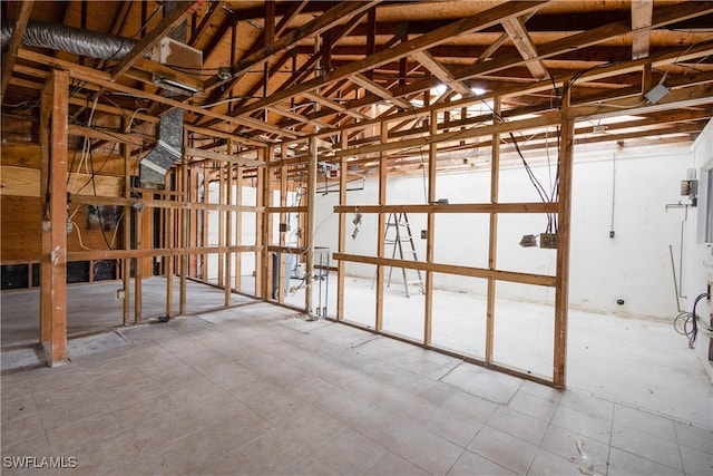 miscellaneous room with lofted ceiling