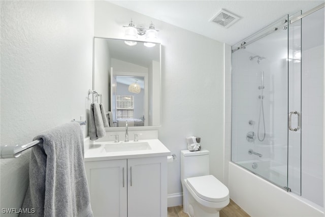 full bathroom with vanity, toilet, lofted ceiling, and combined bath / shower with glass door