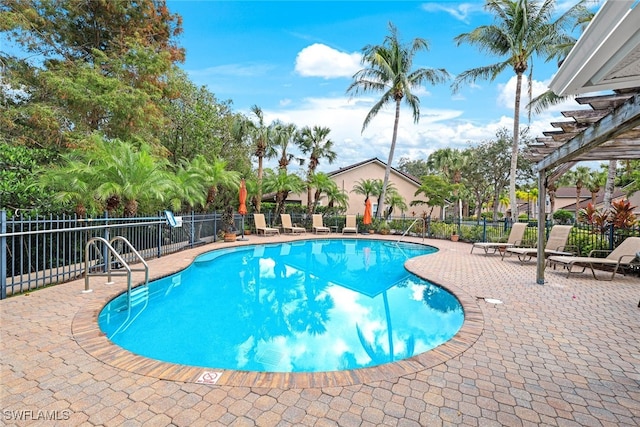 view of swimming pool with a pergola and a patio area