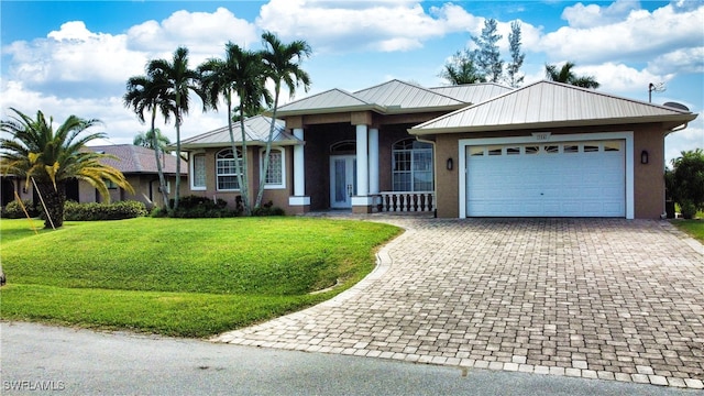 ranch-style house with a garage and a front yard