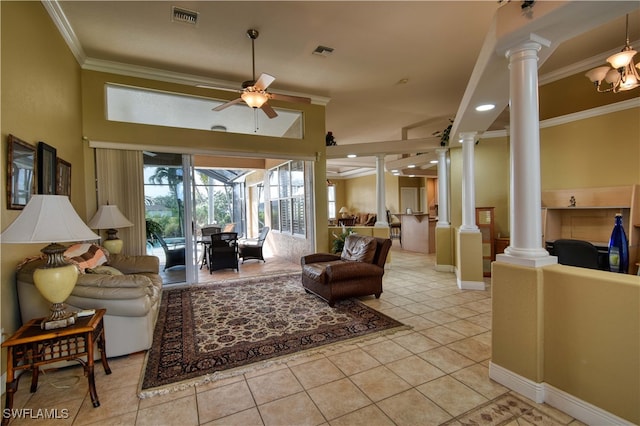 living room featuring ornate columns, crown molding, light tile patterned floors, and ceiling fan