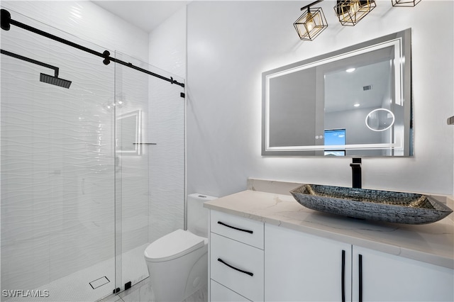 bathroom featuring vanity, toilet, and an enclosed shower