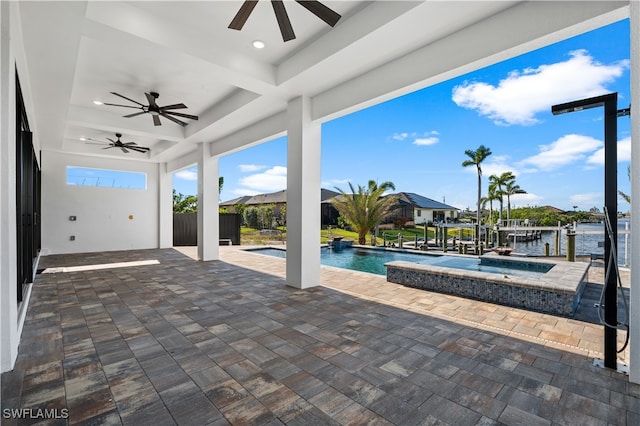 view of swimming pool with a water view, ceiling fan, a patio, and an in ground hot tub