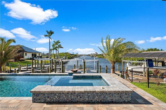 view of swimming pool with an in ground hot tub, a dock, and a water view