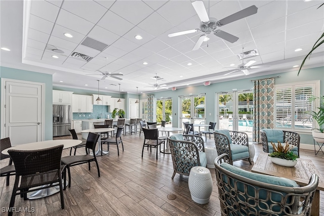 dining space with crown molding, ceiling fan, french doors, and light hardwood / wood-style floors