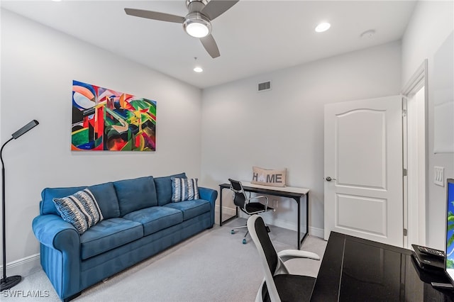 carpeted office featuring ceiling fan